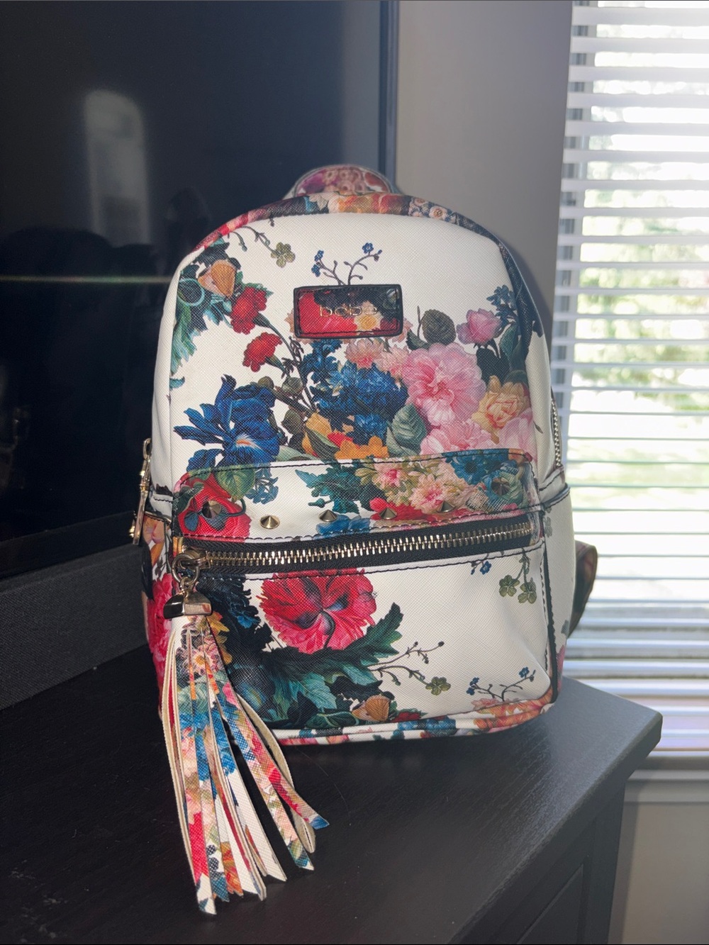bebe White Floral Mini Backpack with Tassel Accent